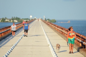 Middle Keys residents favor a sunrise walk across a landmark 2.2-mile section of the old Seven Mile Bridge open to pedestrians and bicyclists. 
